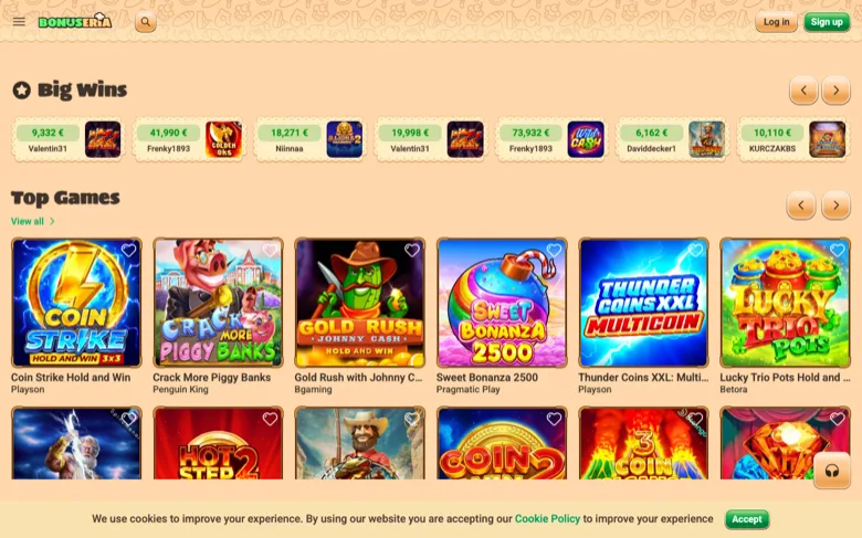 Bonuseria casino lobby with Big Wins ticker and Top Games row